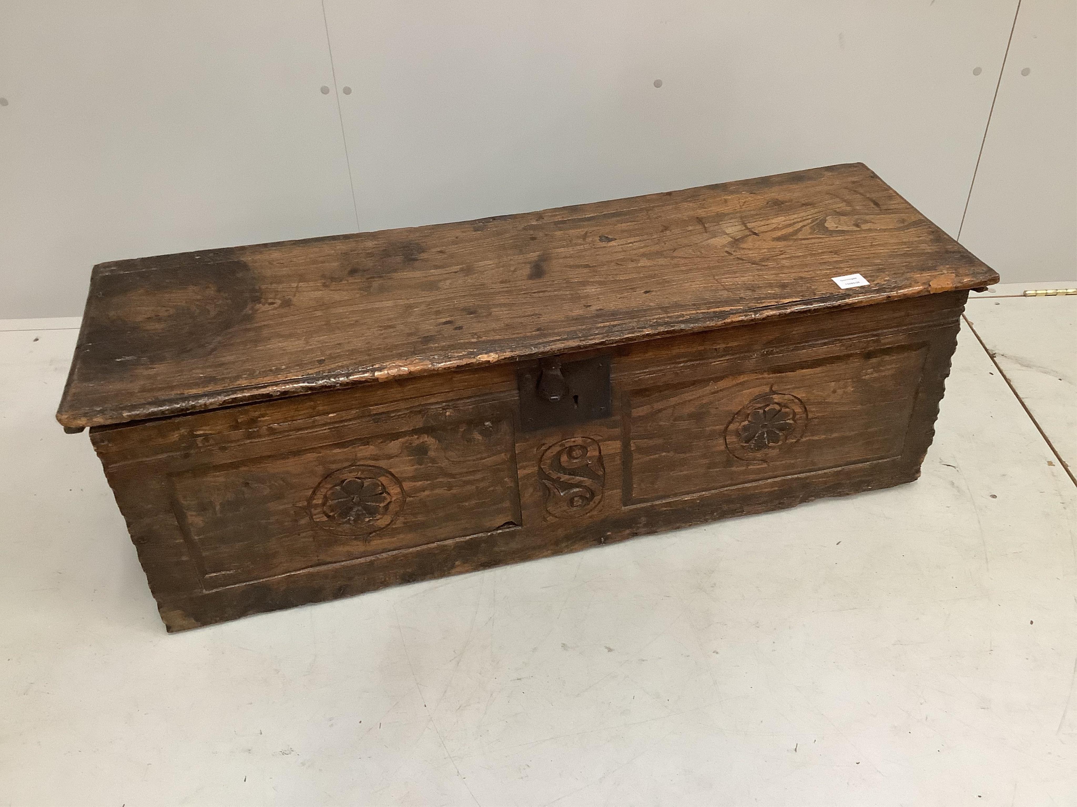 An antique elm six plank coffer, (no legs), width 122cm, depth 39cm, height 40cm. Condition - fair